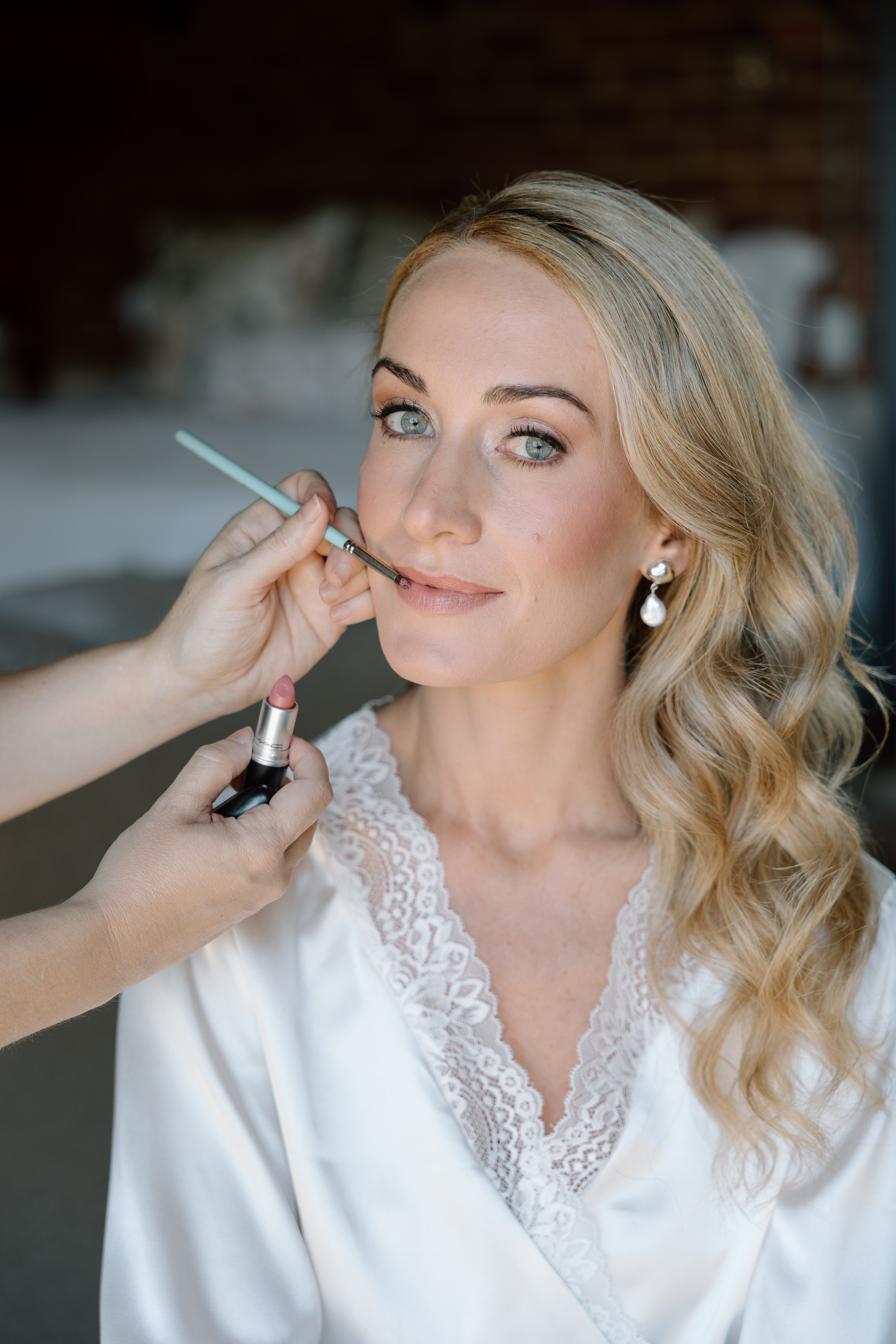 Soft Bridal Makeup, Makeup Artist holding brush